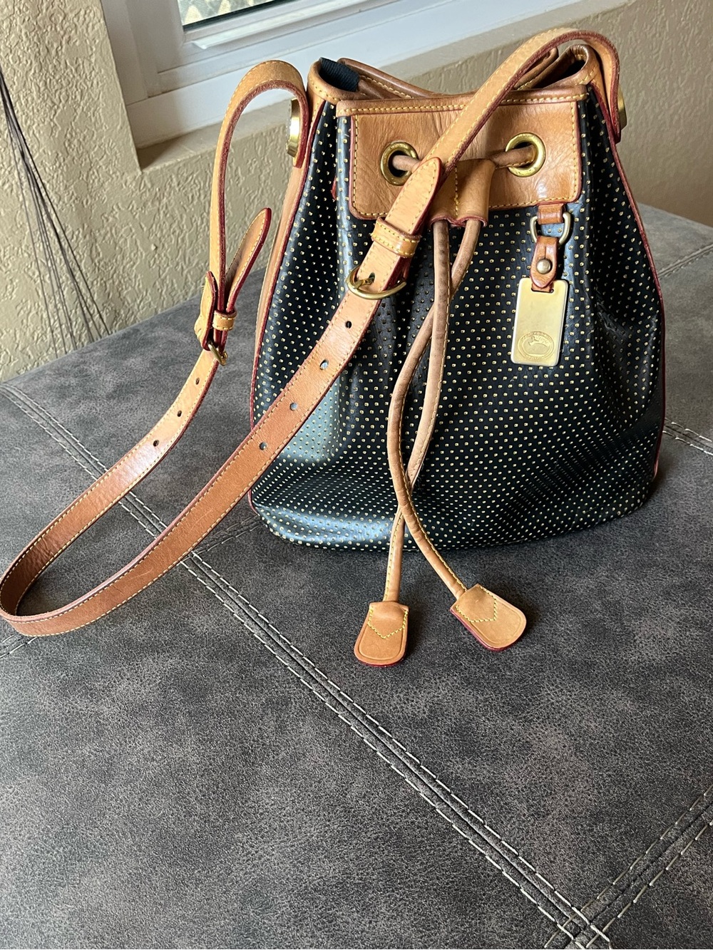 Dooney & Bourke-Vintage Black and Tan Drawstring Bucket Bag with Gold Studs - Picture 9 of 10